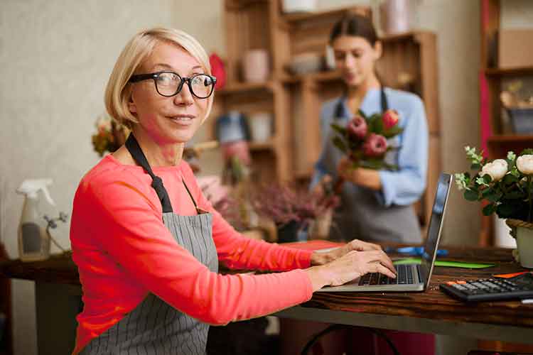 Business Owner Using QuickBooks Business Owner Doing Books